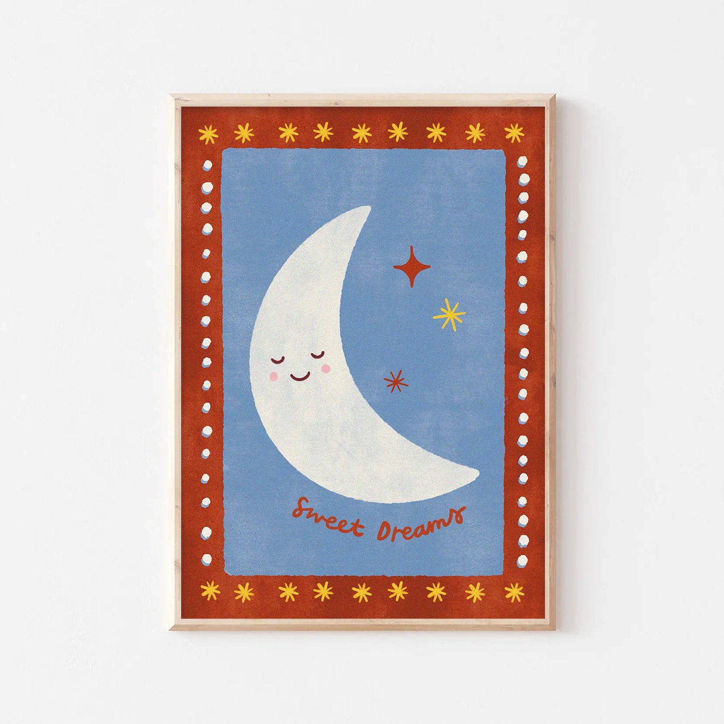 Framed artwork with a smiling moon and stars on a blue background