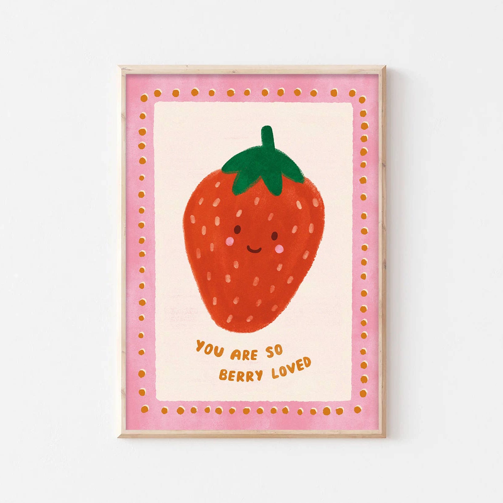 Framed artwork with a strawberry illustration and text on a white background