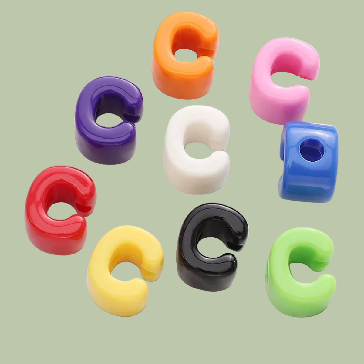Colorful letter 'C' shaped objects on a white plate