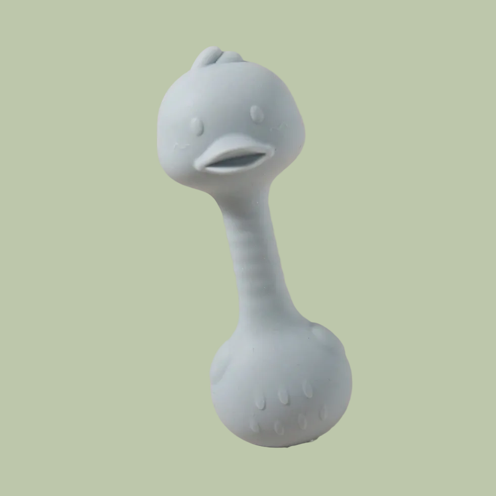 Silicone teething toy with a handle on a beige background