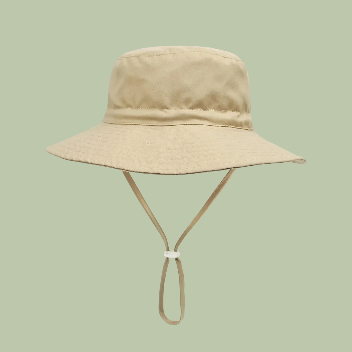 Beige bucket hat with a strap on a white background