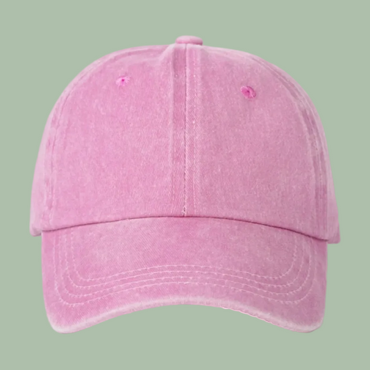 A pink washed cotton baseball cap shown from the front on a clean white background.
