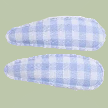 Two blue and white checkered hair clips on a light green background