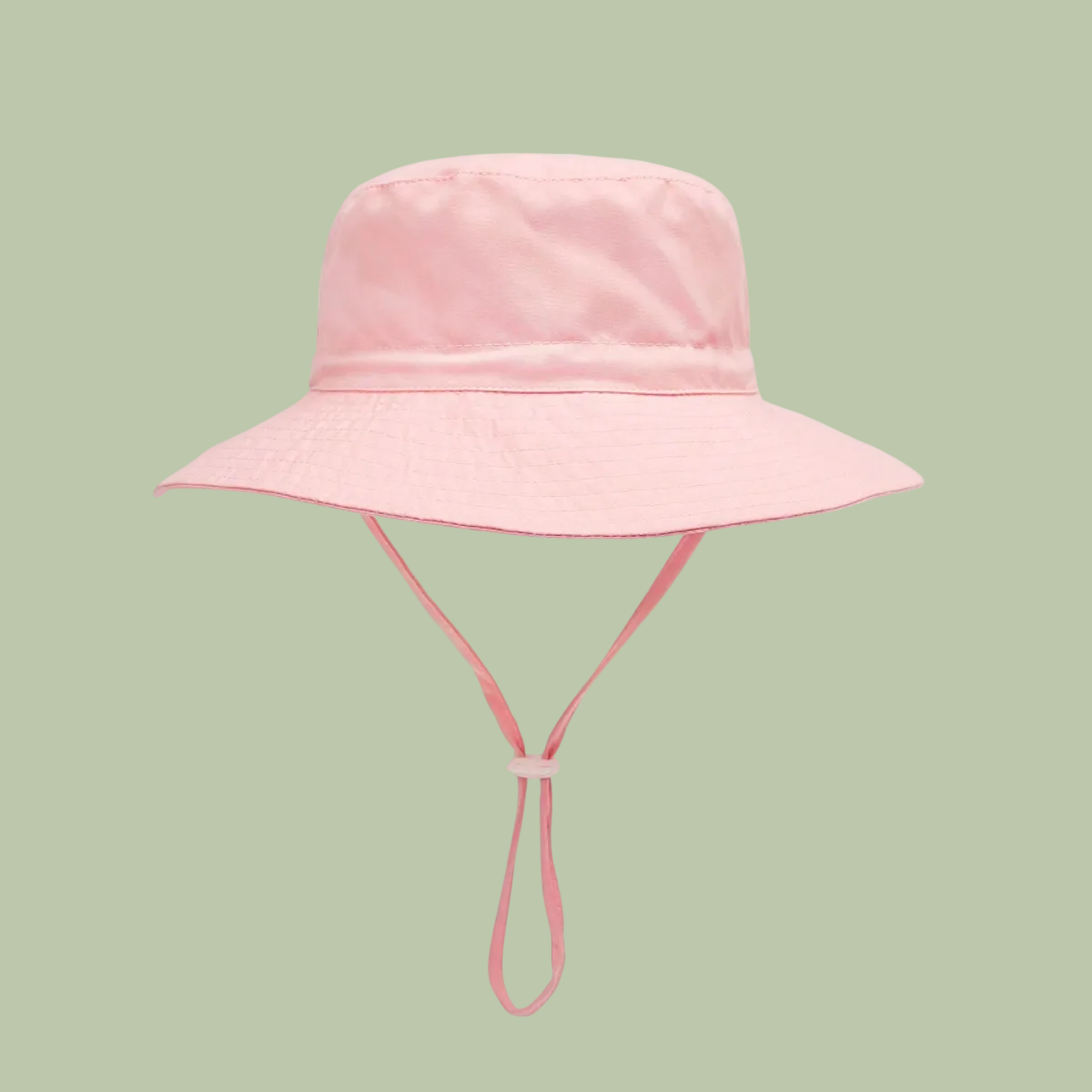 Pink bucket hat with a strap on a white background
