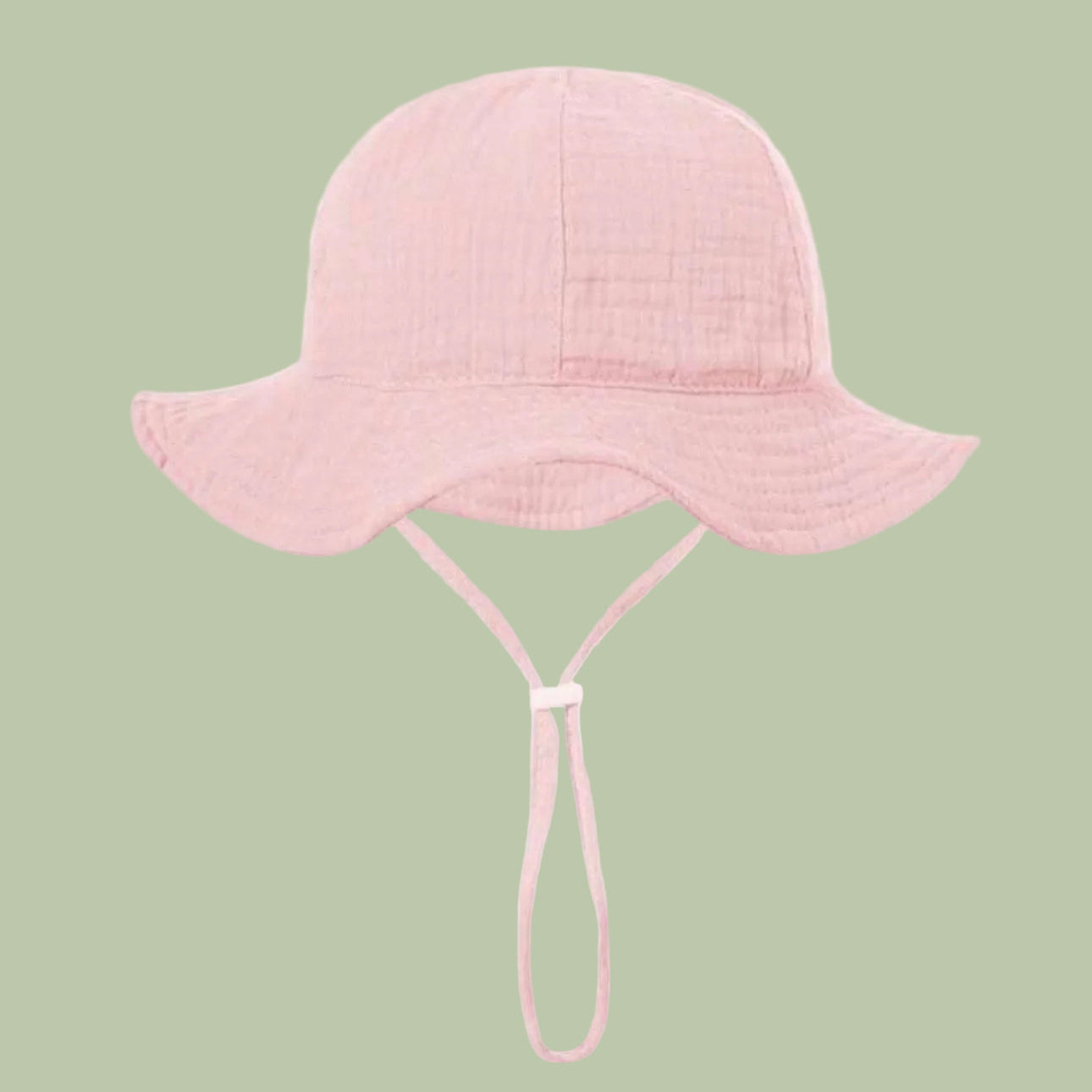 Pink bucket hat with a strap on a white background