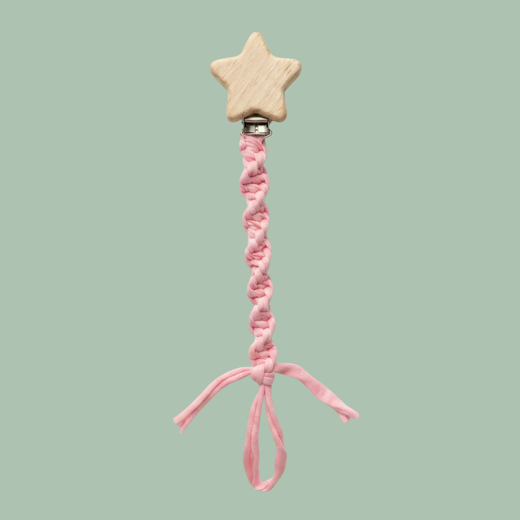 A pink braided pacifier clip with a natural wood star-shaped top
