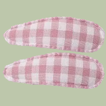 Two pink and white checkered fabric clips on a white background