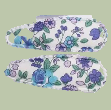 Floral-patterned fabric with blue and purple flowers on a white background